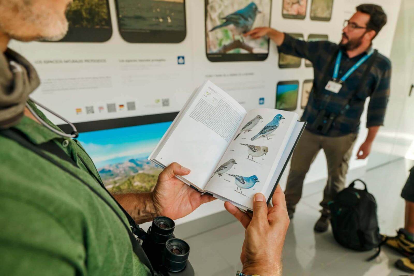 Local specialist guide explaining at bird interpretation centre in Canary Islands.