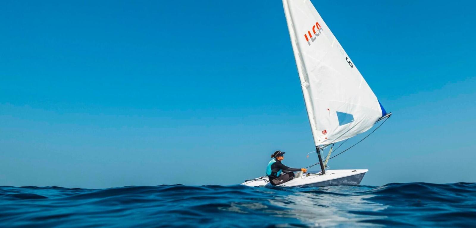 Dinghy sailing on calm seas in the Canary Islands.